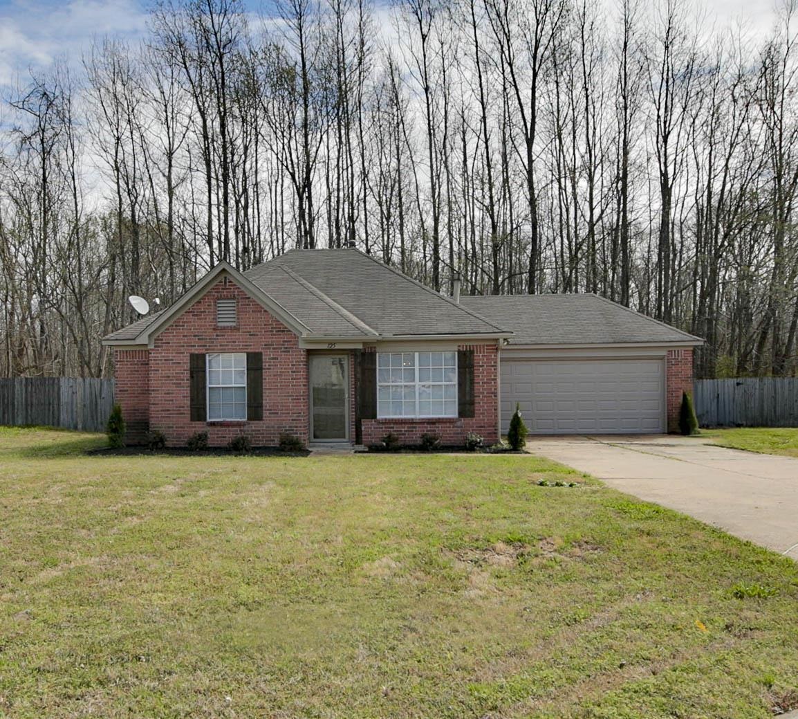 Ranch-style home with brick siding, driveway, an attached garage, and roof with shingles
