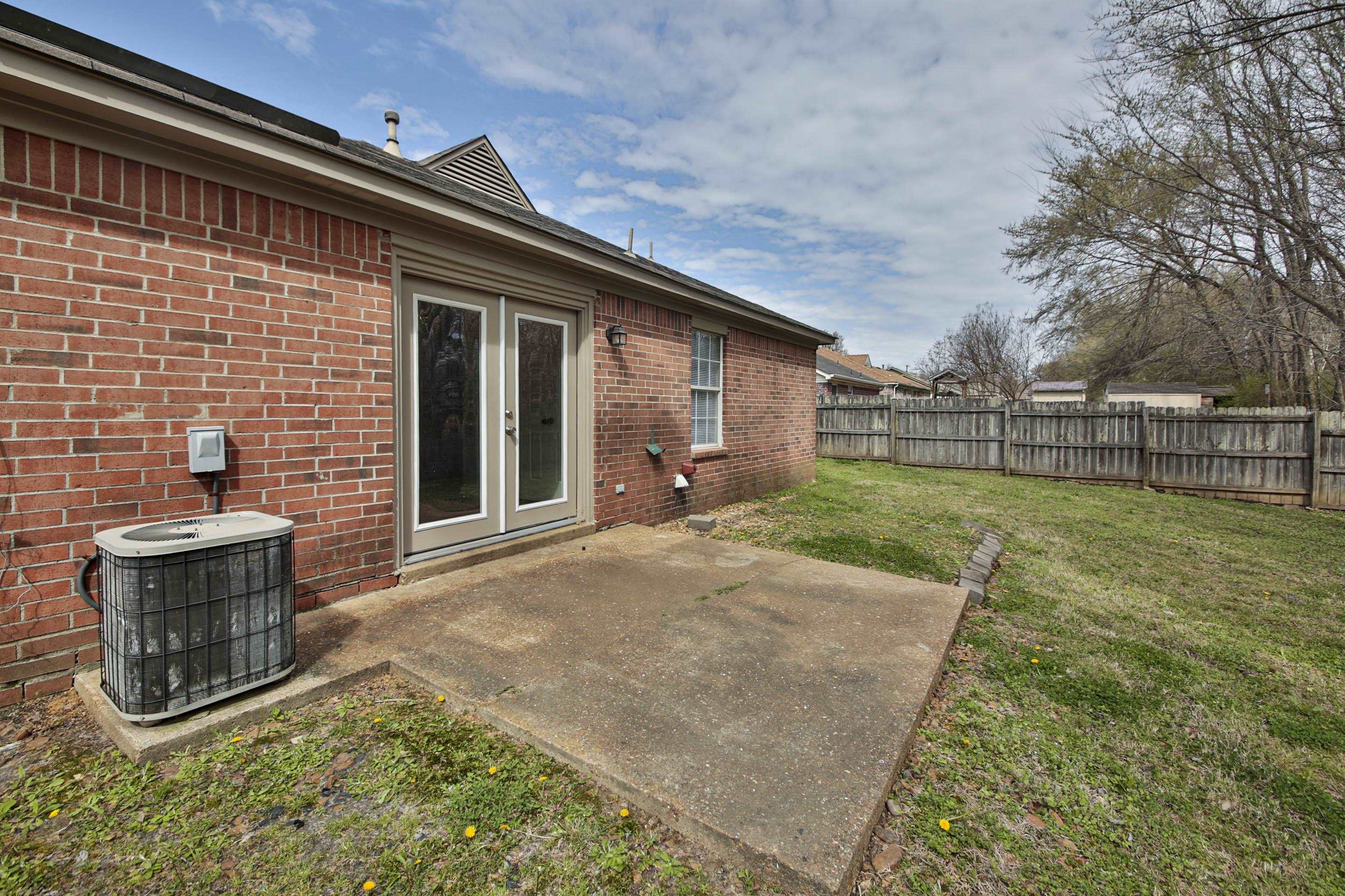 125 Pine Ridge Lane Oakland, TN 38060 - Photo 22 of 24 Fenced backyard with a patio and french doors