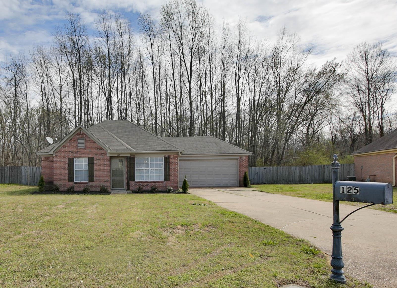 125 Pine Ridge Lane Oakland, TN 38060 - Photo 24 of 24 Ranch-style home featuring brick siding, concrete driveway, an attached garage, and a shingled roof