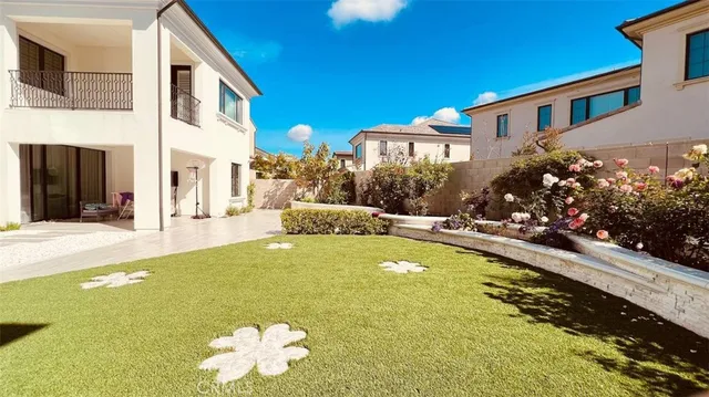 a swimming pool with yard and outdoor seating