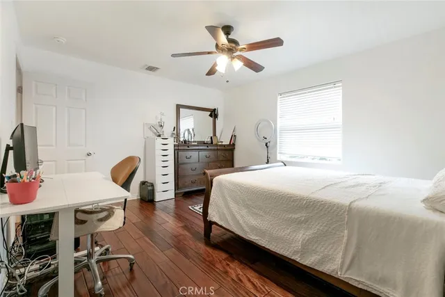 a bedroom with a bed furniture and a window