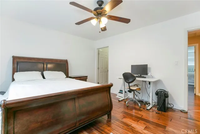 a bedroom with a bed and a table in it