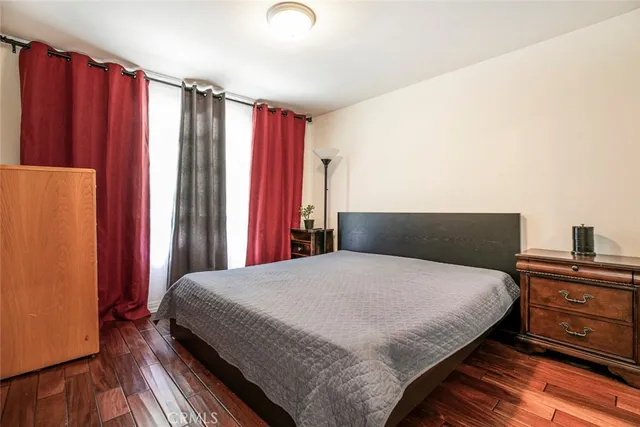 a bedroom with a bed and a dresser