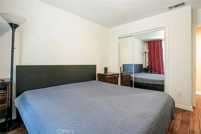 a bedroom with a bed and chair