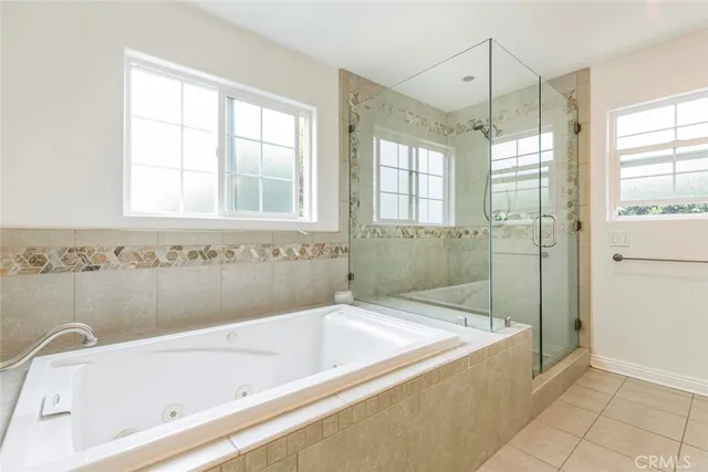 a bathroom with a bathtub and a shower