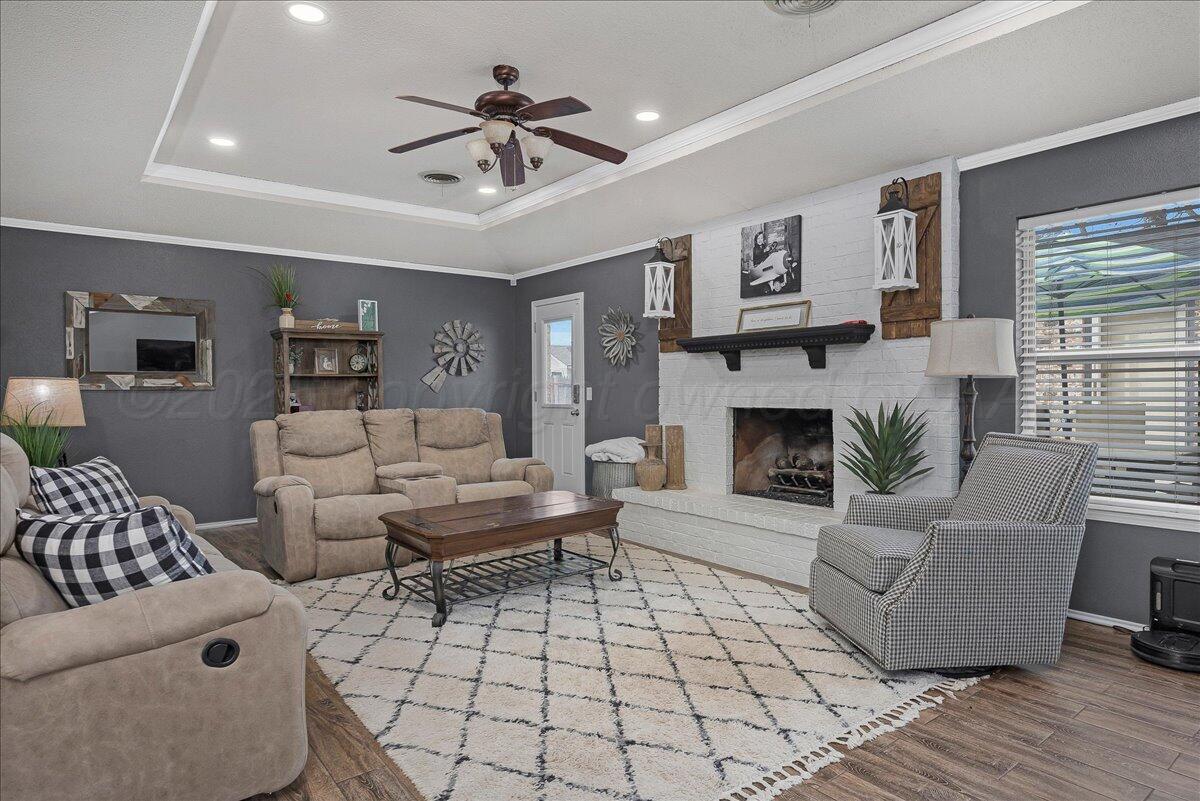6912 Manor Circle Amarillo, TX 79109 - Photo 5 of 25 a living room with furniture and a fireplace