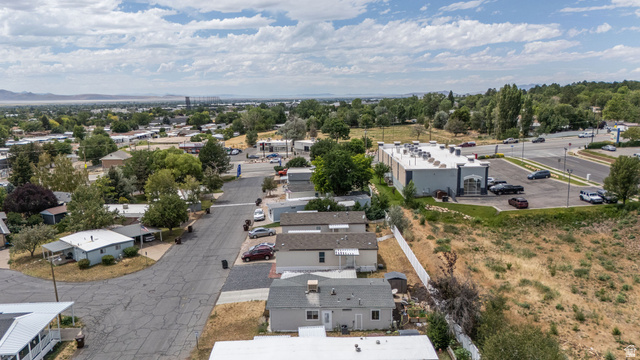 2600 North Hill Field Road, Unit 5 Layton, UT 84041 - Photo 31 of 33 Aerial perspective showcasing residential properties and a commercial building