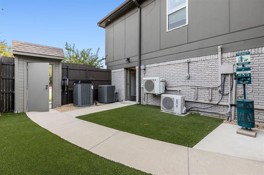 4436 Thunder Road Dallas, TX 75244 - Photo 29 of 33 Paved pathway with artificial turf and a dedicated pet waste station