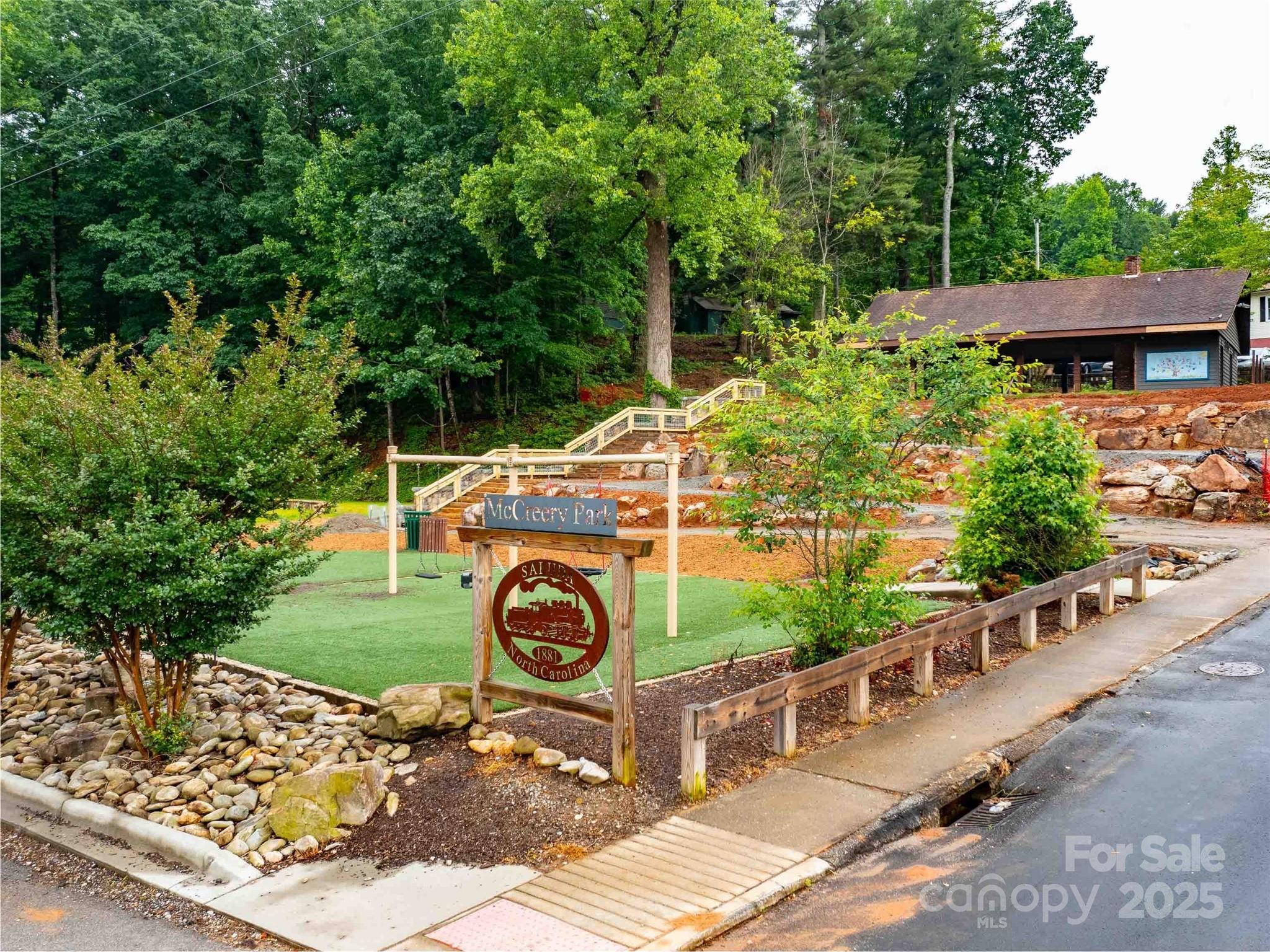 0 Mountain Page Road, Unit 17 18 19 Saluda, NC 28773 - Photo 28 of 42 an aerial view of a house with a yard