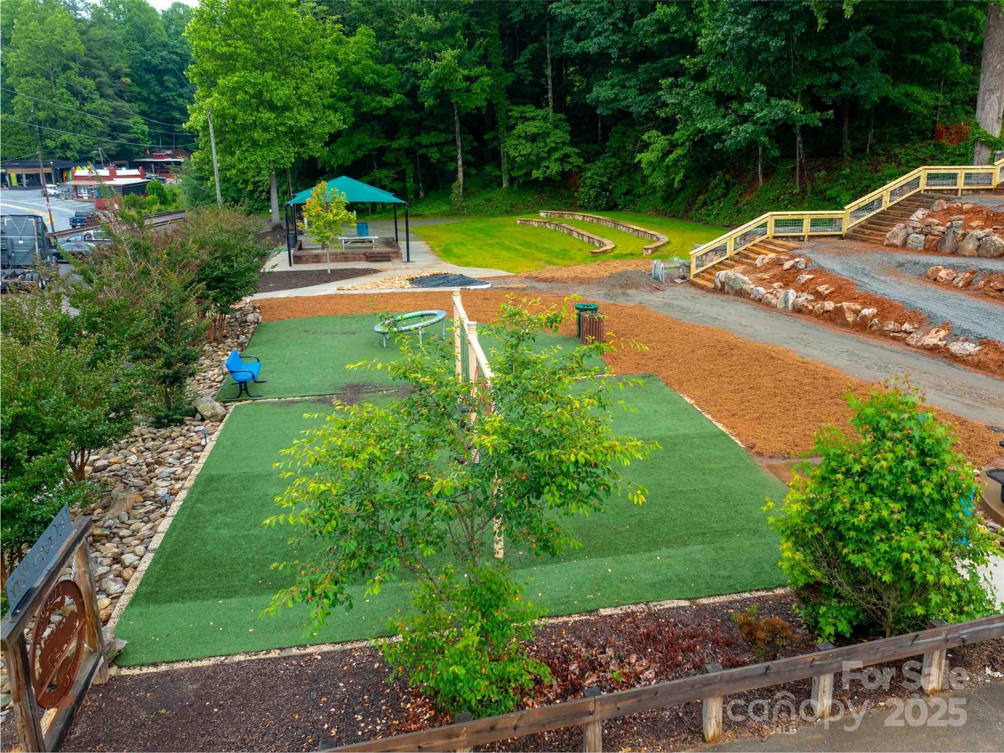 0 Mountain Page Road, Unit 17 18 19 Saluda, NC 28773 - Photo 29 of 42 a view of a swimming pool with a garden