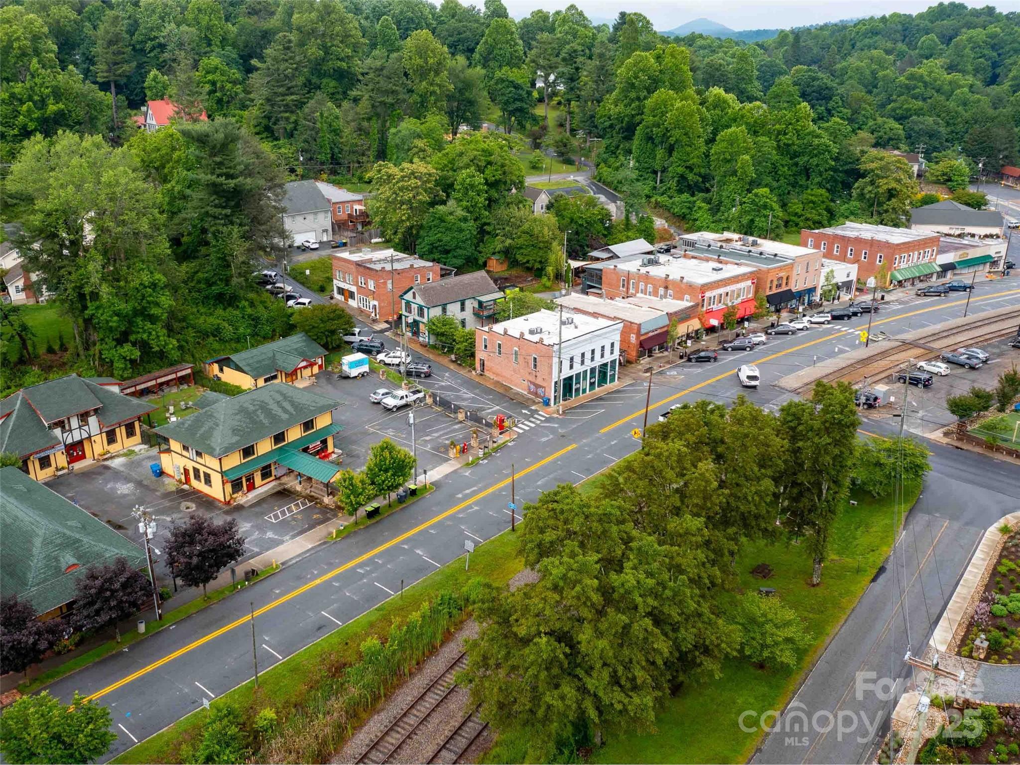 0 Mountain Page Road, Unit 17 18 19 Saluda, NC 28773 - Photo 32 of 42 an aerial view of a city with lots of residential buildings