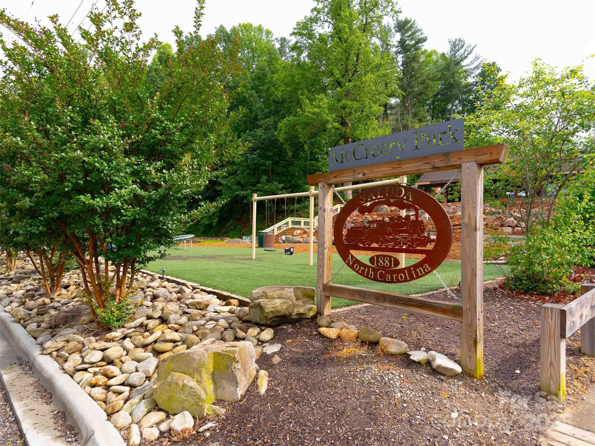 0 Mountain Page Road, Unit 17 18 19 Saluda, NC 28773 - Photo 33 of 42 a view of a backyard with wooden floor and outdoor seating