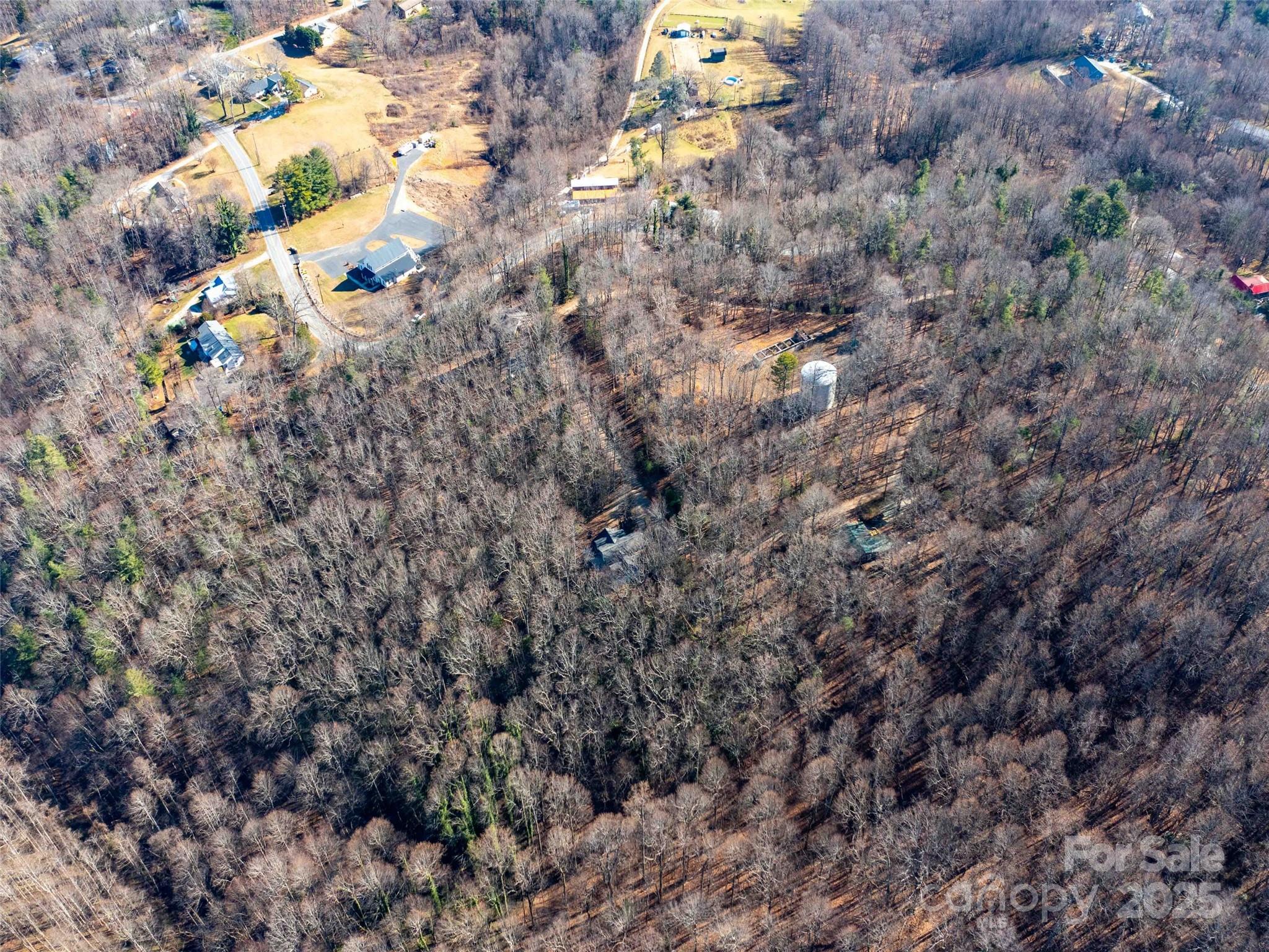 0 Mountain Page Road, Unit 17 18 19 Saluda, NC 28773 - Photo 9 of 42 a view of a house with a tree