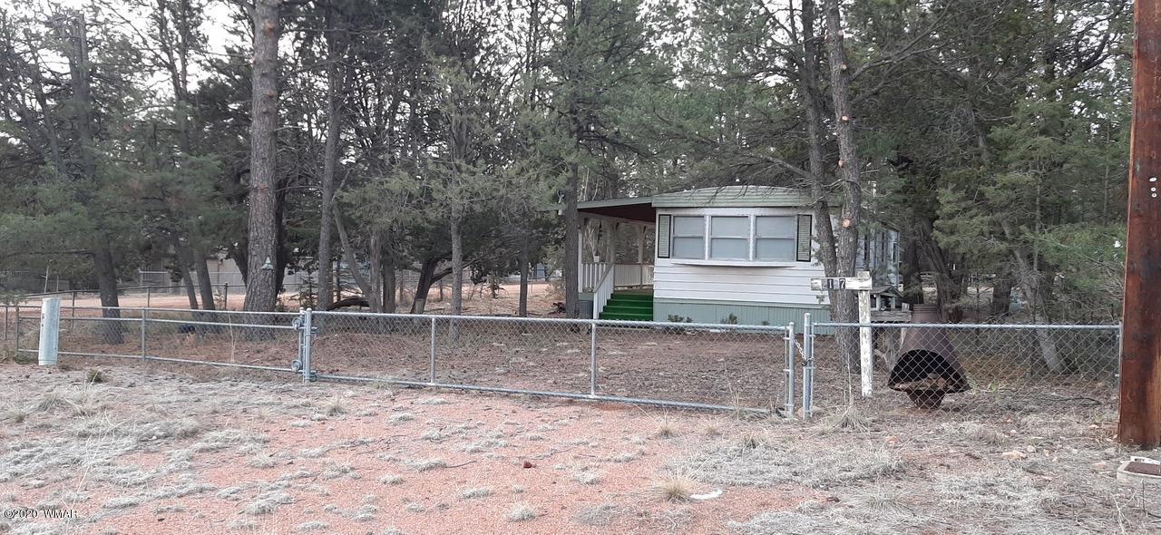 2127 Chevelon Road Overgaard, AZ 85933 - Photo 1 of 4 a view of house with a backyard