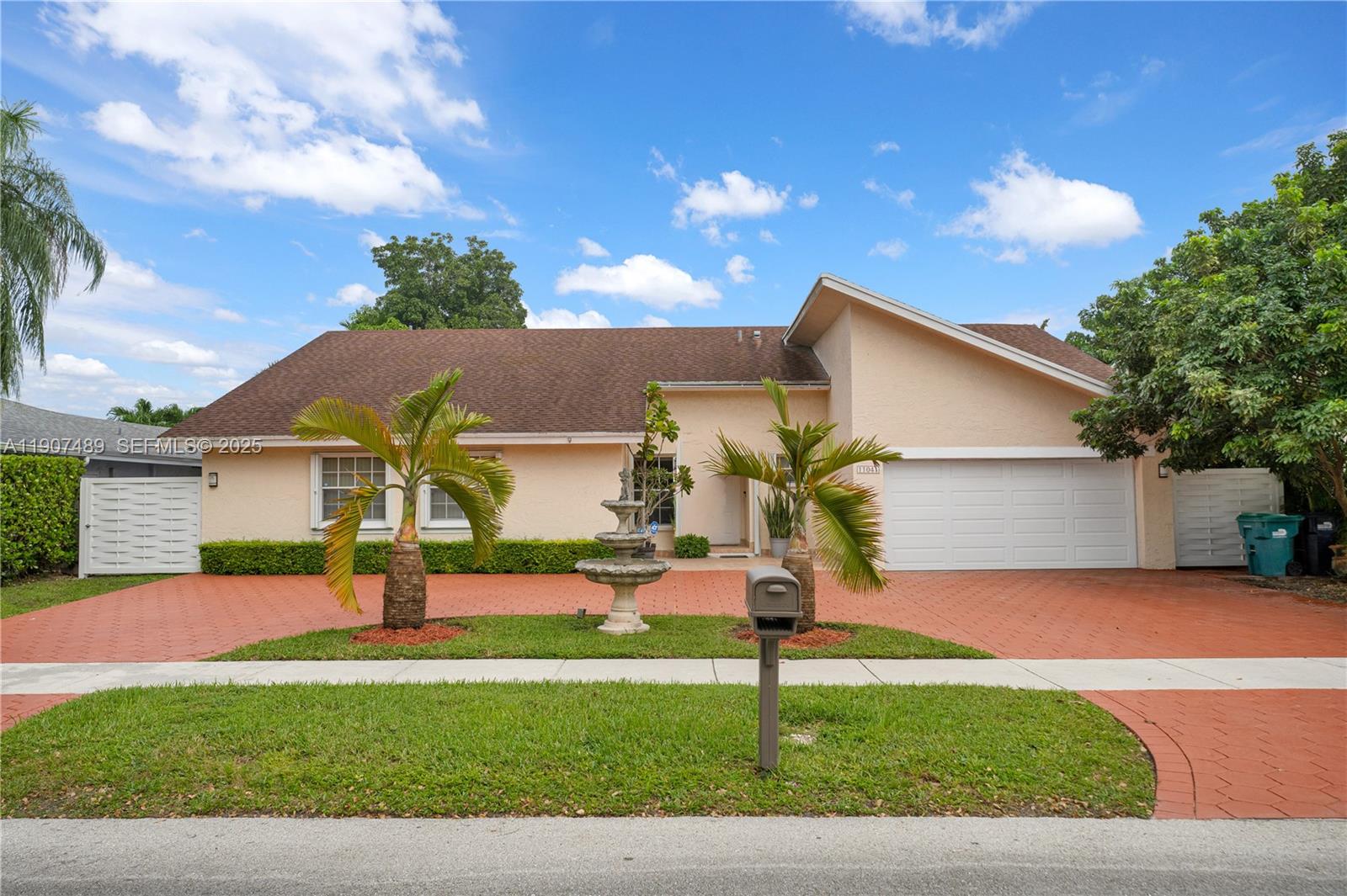 11041 Southwest 138th Avenue Miami, FL 33186 - Photo 1 of 33 a front view of house with yard and trees