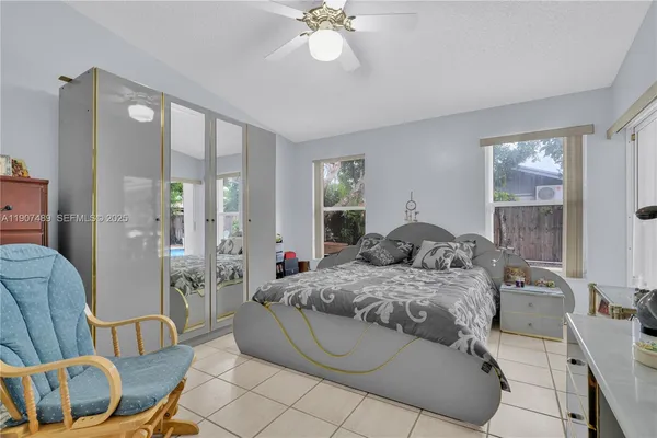 a bedroom with a bed and window