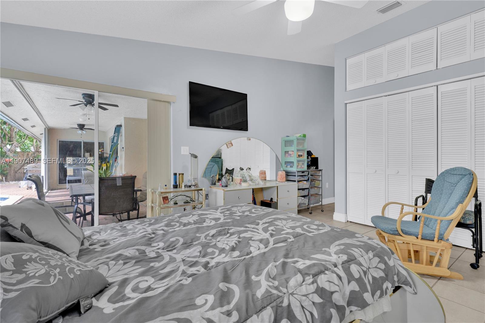 11041 Southwest 138th Avenue Miami, FL 33186 - Photo 19 of 33 a living room with furniture a flat screen tv and large window