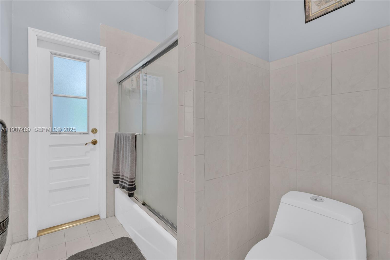 11041 Southwest 138th Avenue Miami, FL 33186 - Photo 25 of 33 a bathroom with a shower and toilet