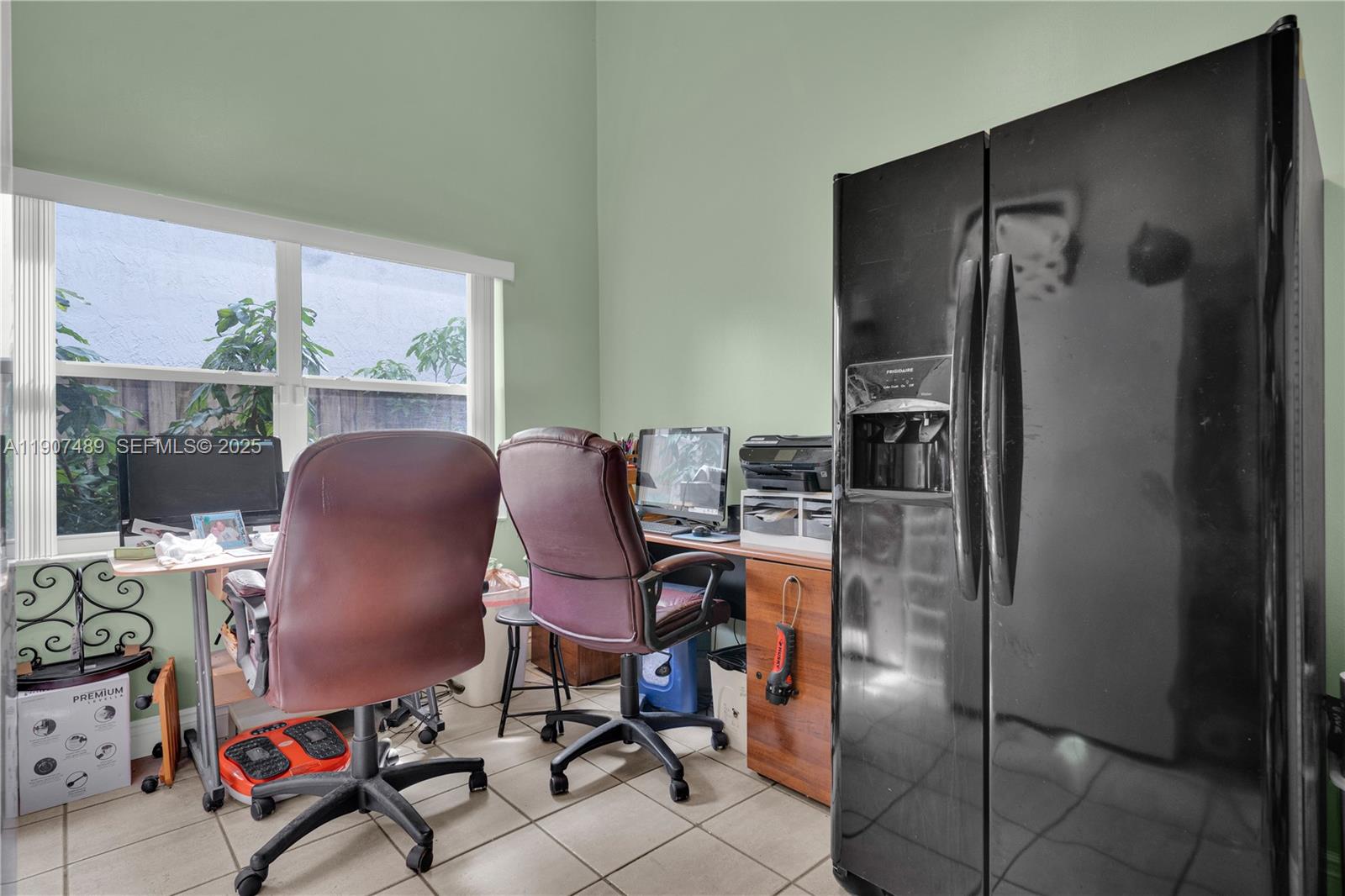 11041 Southwest 138th Avenue Miami, FL 33186 - Photo 28 of 33 a view of a workspace with furniture and a window