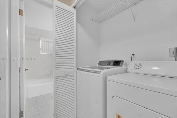 a utility room with dryer and washer