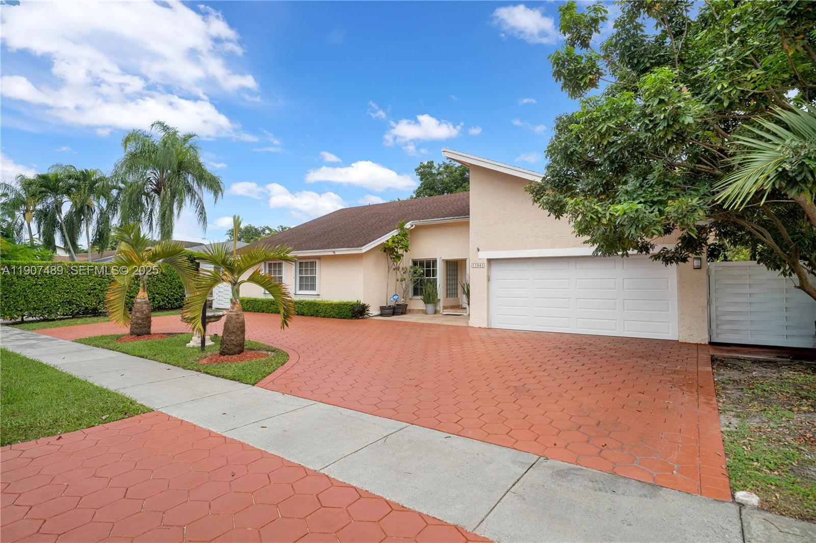11041 Southwest 138th Avenue Miami, FL 33186 - Photo 3 of 33 a front view of house with yard and trees