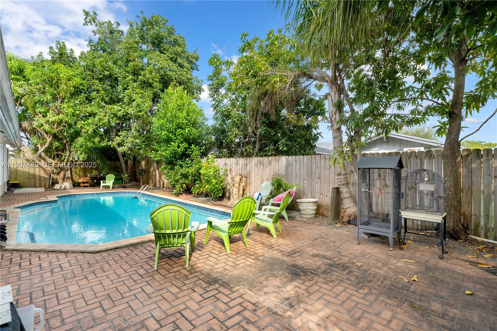 11041 Southwest 138th Avenue Miami, FL 33186 - Photo 31 of 33 a view of backyard with swimming pool and furniture