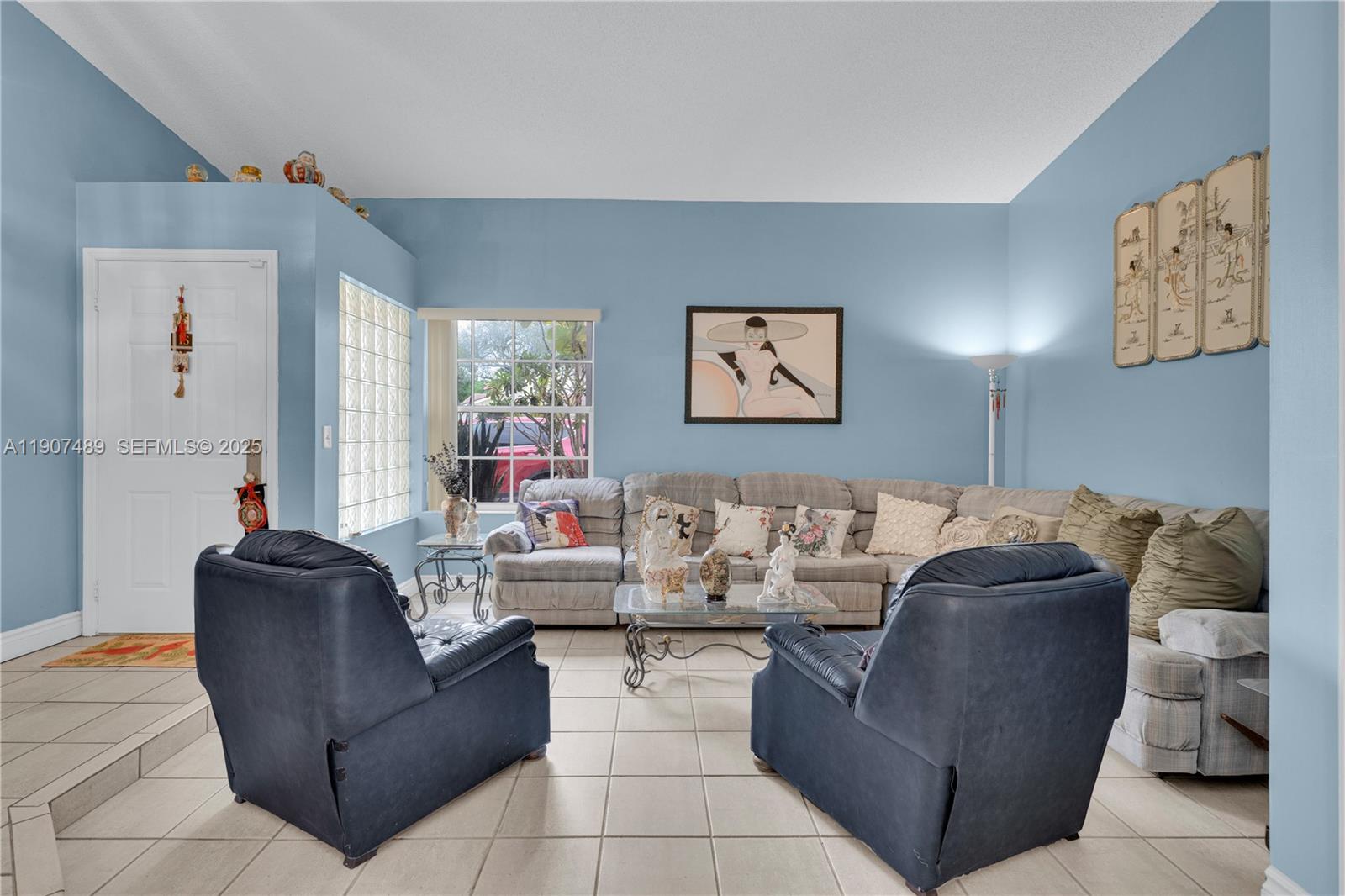 11041 Southwest 138th Avenue Miami, FL 33186 - Photo 5 of 33 a living room with furniture and a large window