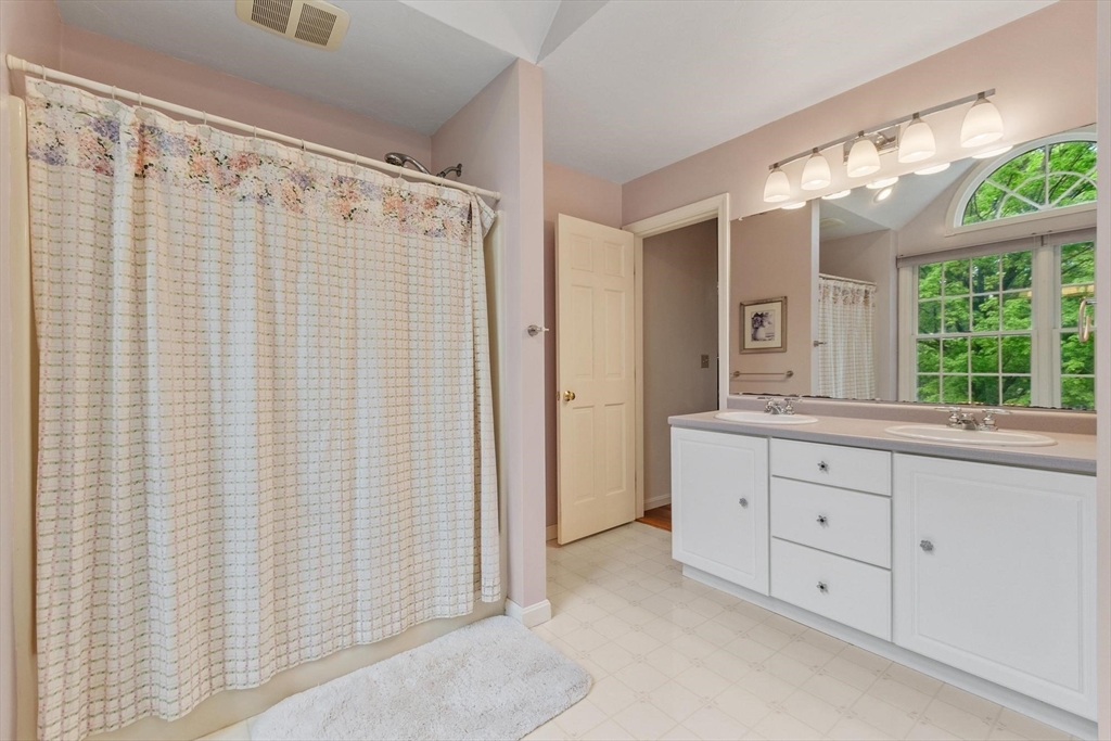 94 Turner Road Townsend, MA 01469 - Photo 27 of 42 a bathroom with a double vanity sink and a mirror