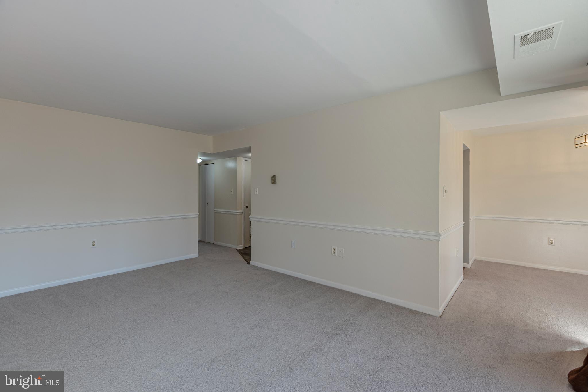 1536 Northgate Square, Unit 12A Reston, VA 20190 - Photo 17 of 30 Living Room Opens to Dining Room