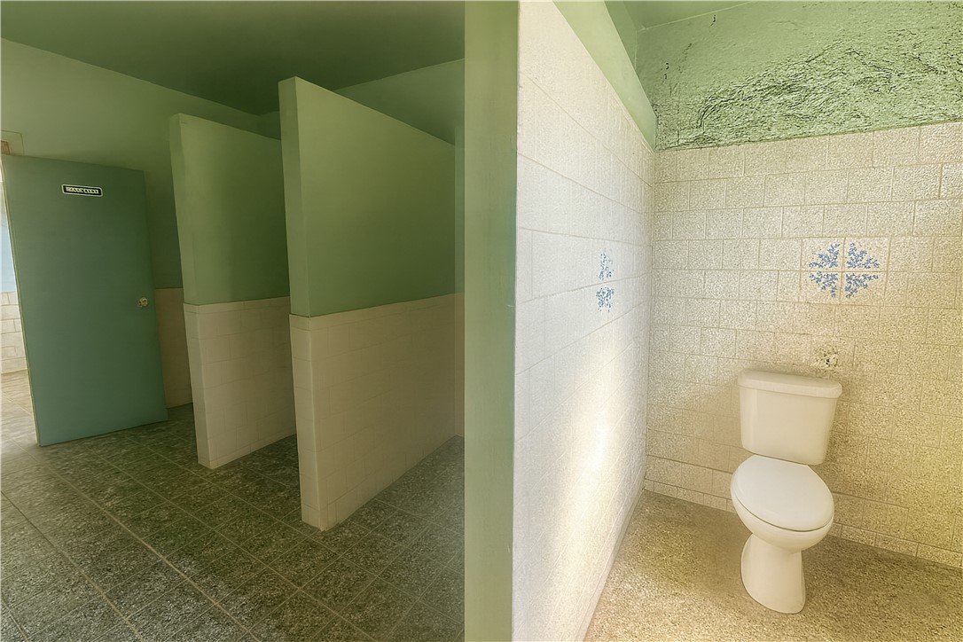 208 West Anaheim Street Long Beach, CA 90813 - Photo 21 of 53 a white toilet sitting next to a bathroom sink