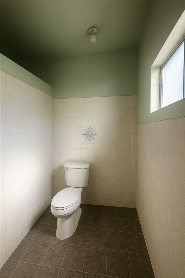 208 West Anaheim Street Long Beach, CA 90813 - Photo 23 of 53 a white toilet sitting next to a window