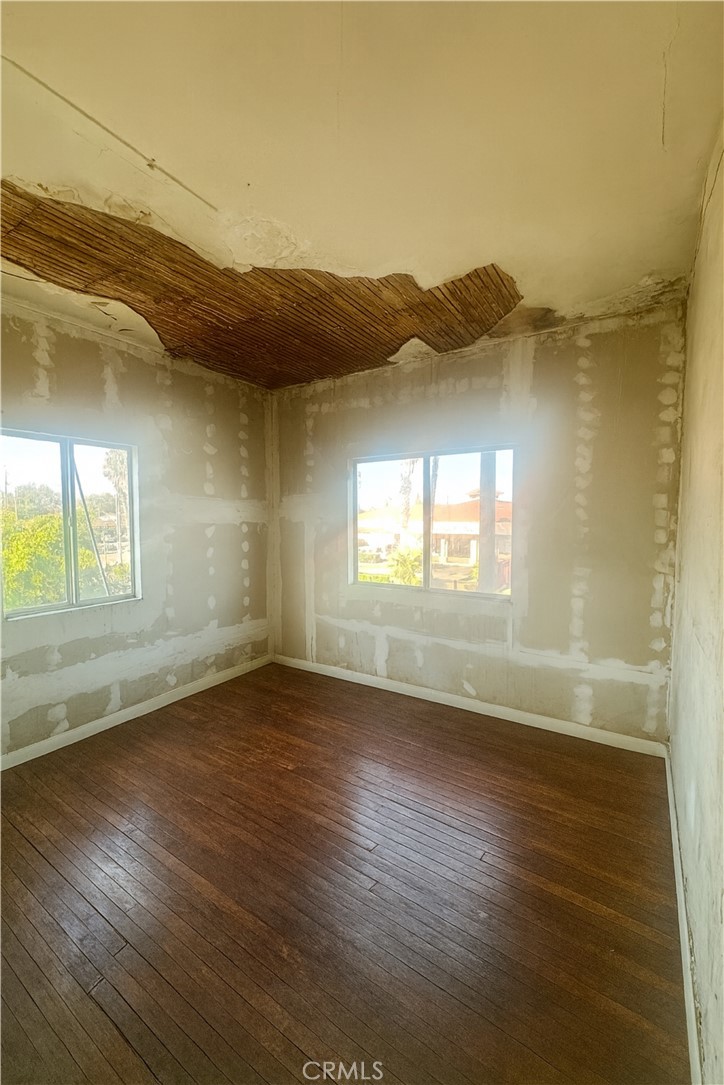 208 West Anaheim Street Long Beach, CA 90813 - Photo 52 of 53 an empty room with wooden floor and windows