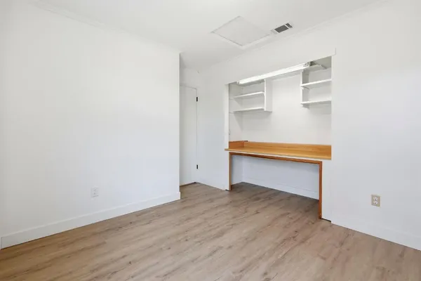 a hallway with wooden floor