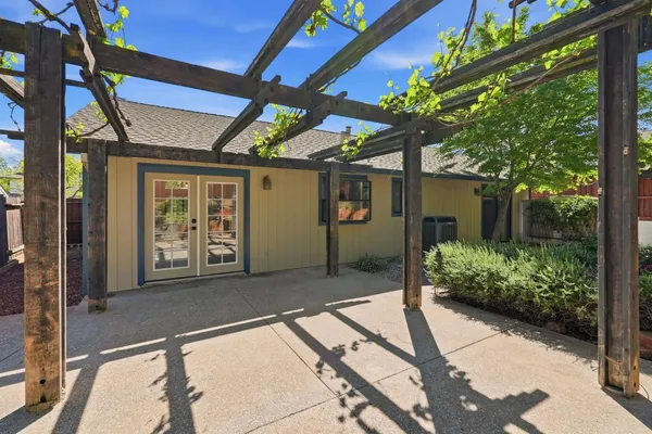 a view of a house with backyard and porch