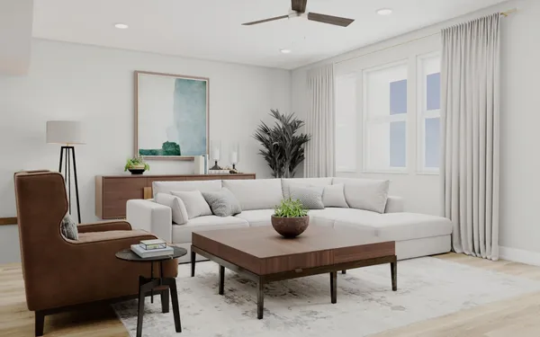 a living room with furniture and a potted plant