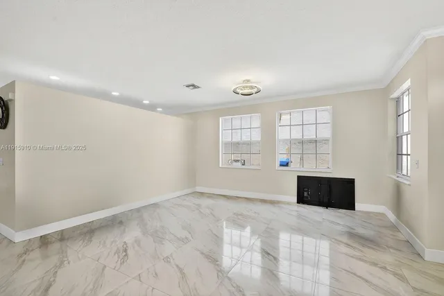 a bedroom with a bed and a ceiling fan