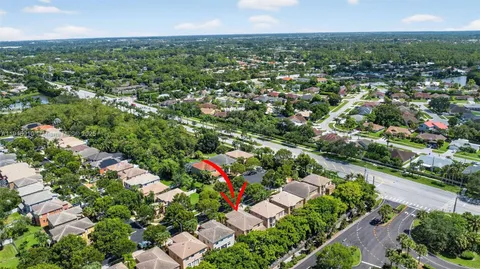 a view of swimming pool with outdoor seating and lake view