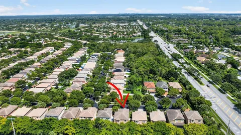 an aerial view of a house with a swimming pool yard and outdoor seating