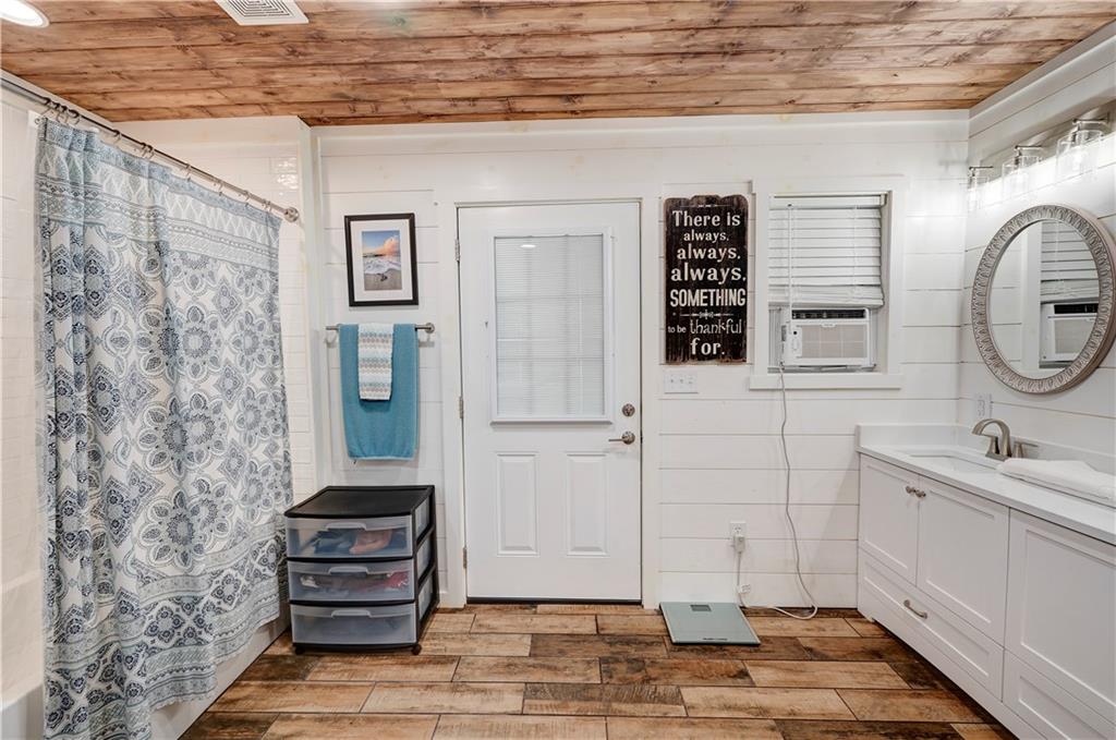 2453 Boone Ford Road Southeast Calhoun, GA 30701 - Photo 111 of 135 a bathroom with a sink a toilet and shower