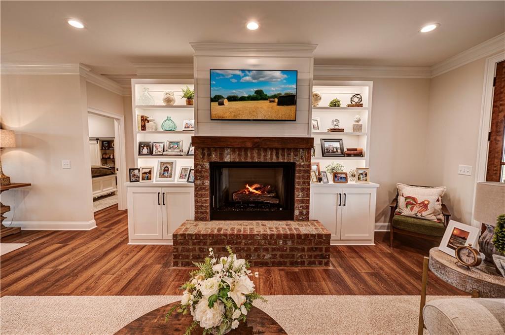 2453 Boone Ford Road Southeast Calhoun, GA 30701 - Photo 12 of 135 a living room with furniture and a fireplace