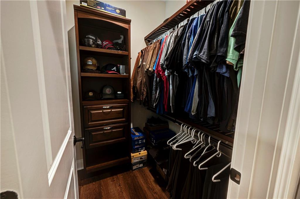 2453 Boone Ford Road Southeast Calhoun, GA 30701 - Photo 22 of 135 a view of walk in closet with clothes and shoes