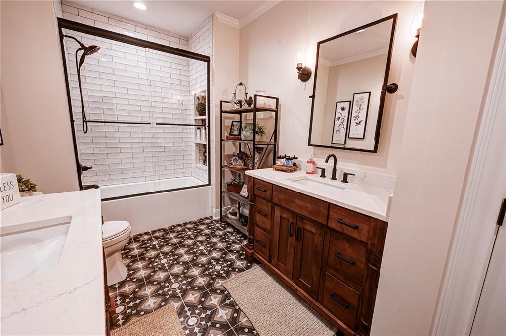 2453 Boone Ford Road Southeast Calhoun, GA 30701 - Photo 26 of 135 a bathroom with a sink a mirror and a shower
