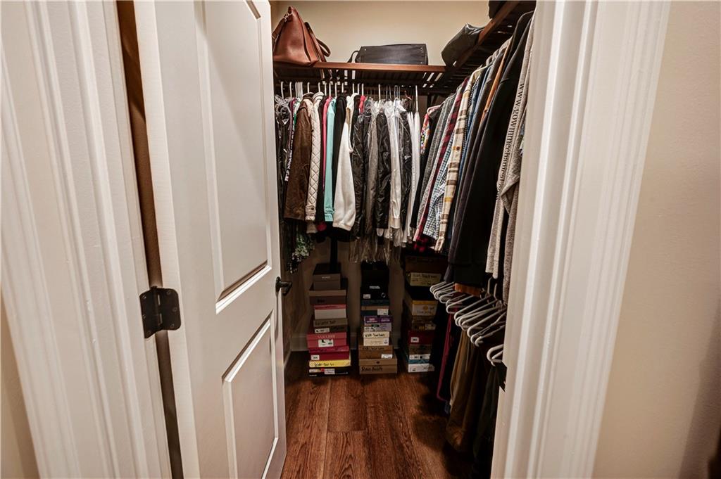 2453 Boone Ford Road Southeast Calhoun, GA 30701 - Photo 31 of 135 a view of walk in closet with clothes and shoes