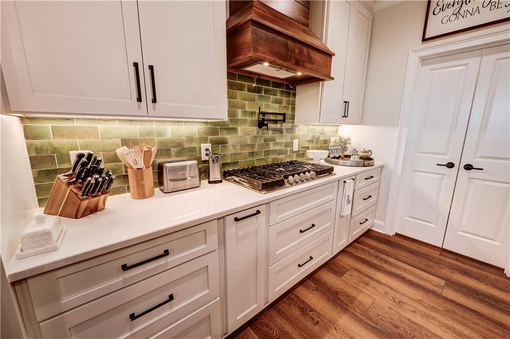 2453 Boone Ford Road Southeast Calhoun, GA 30701 - Photo 42 of 135 a kitchen with granite countertop white cabinets and white appliances