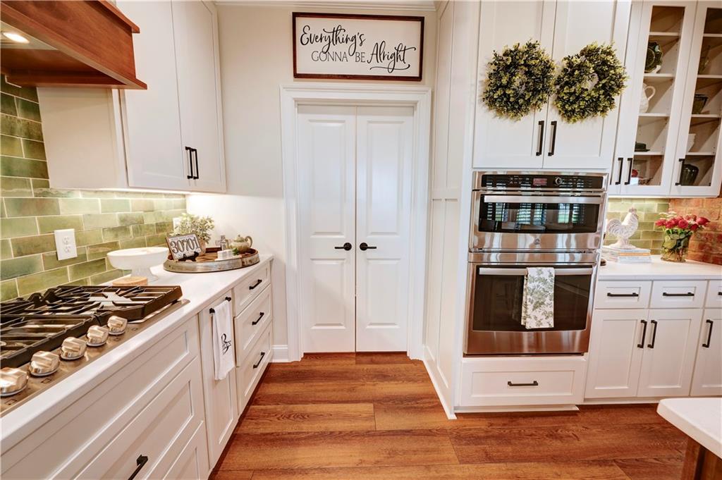 2453 Boone Ford Road Southeast Calhoun, GA 30701 - Photo 45 of 135 a kitchen with stainless steel appliances a stove and a refrigerator