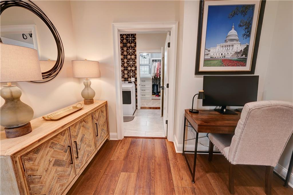 2453 Boone Ford Road Southeast Calhoun, GA 30701 - Photo 53 of 135 a view of a hallway with wooden floor and staircase
