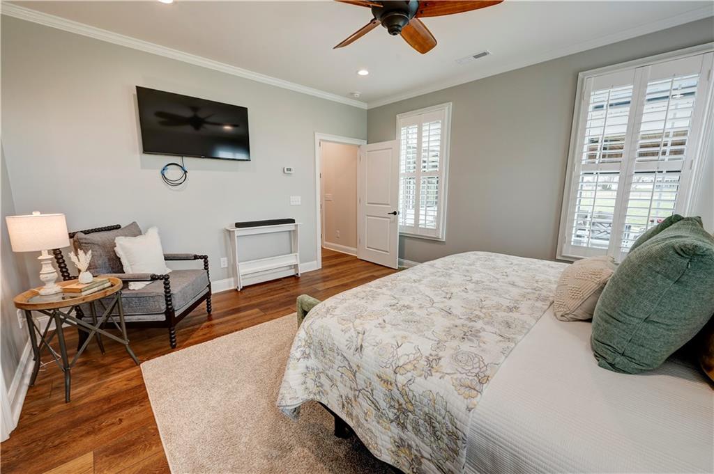 2453 Boone Ford Road Southeast Calhoun, GA 30701 - Photo 60 of 135 a bedroom with a bed a flat screen tv and a window