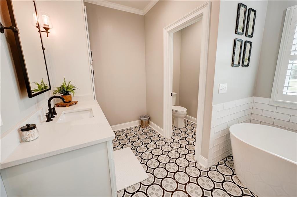 2453 Boone Ford Road Southeast Calhoun, GA 30701 - Photo 63 of 135 a bathroom with a sink a toilet and a mirror