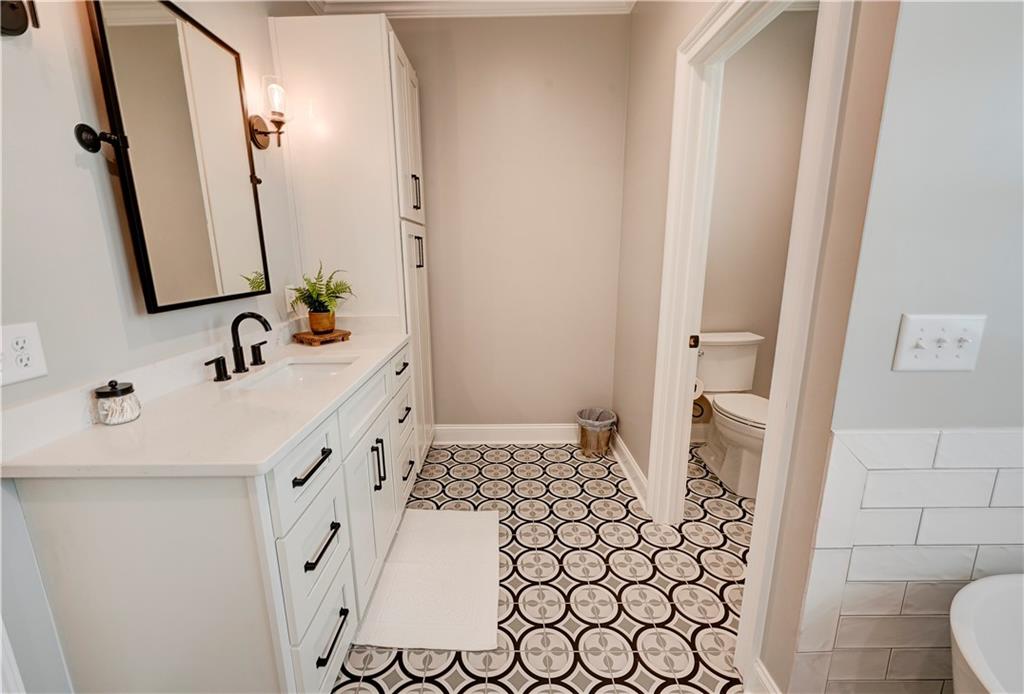 2453 Boone Ford Road Southeast Calhoun, GA 30701 - Photo 64 of 135 a bathroom with a sink and a mirror