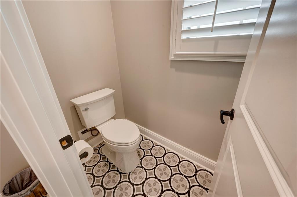 2453 Boone Ford Road Southeast Calhoun, GA 30701 - Photo 66 of 135 a white toilet sitting next to a shower